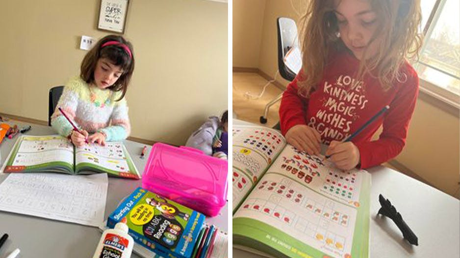 Homeschooled Kindergarten girl learning with ABC Reading Eggs workbooks.